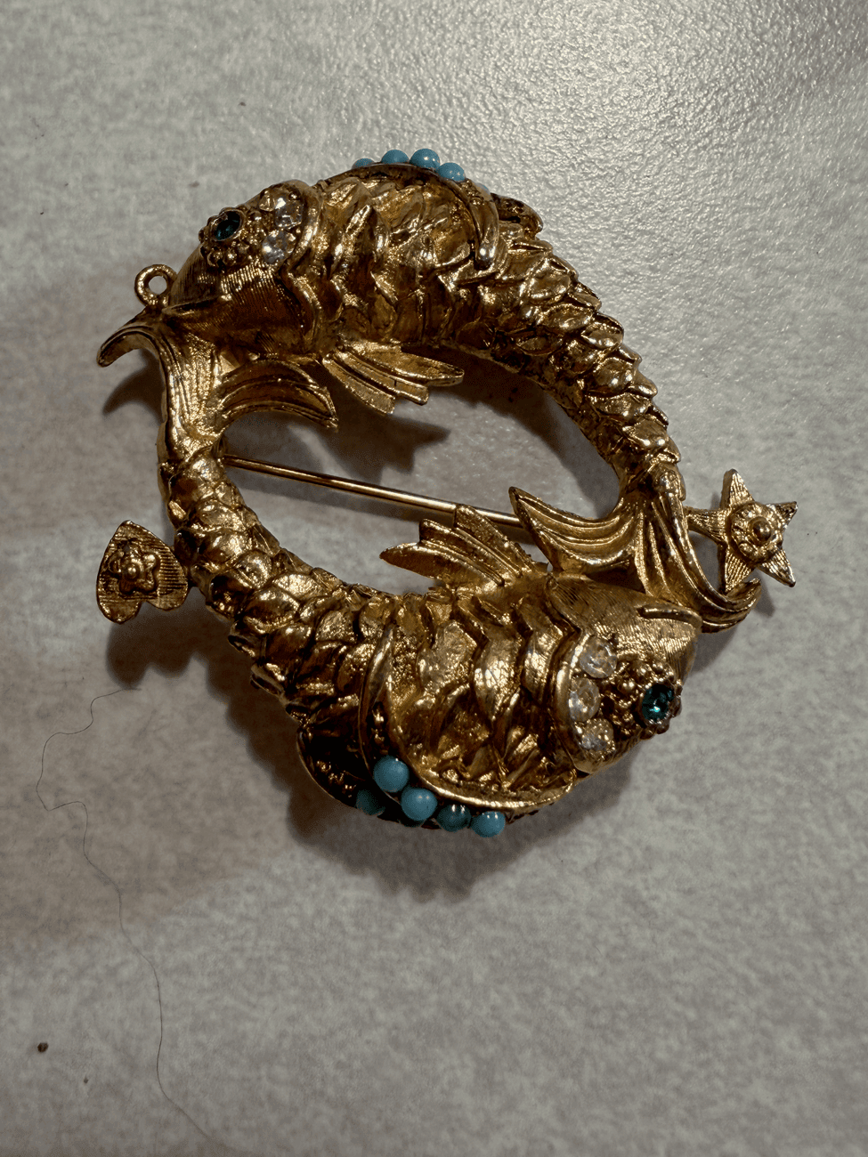 Double-fish brooch, front angle
